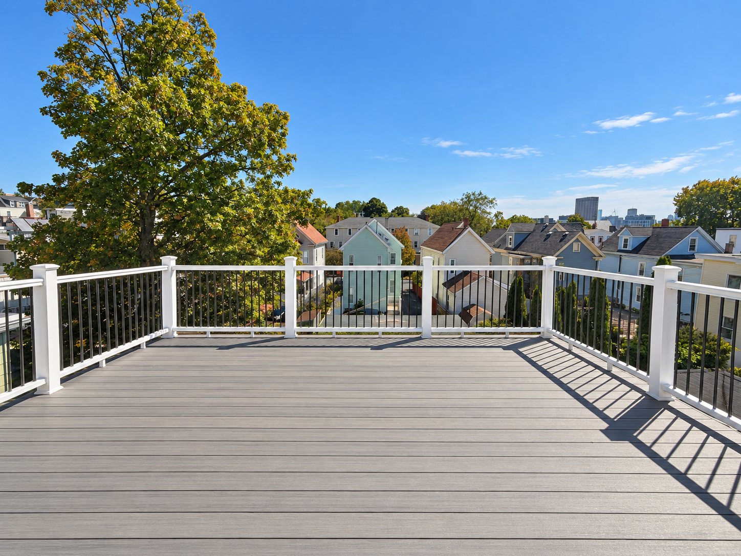 Unit 2's private roof deck overlooking Spring Hill toward the Boston skyline